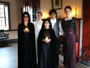 The cast and director of “The Raven” relax for a moment before a performance in the Doak House Museum of “Edgar Allan Poe and Other Haunted Stories in the Woods.” Left to right are Bo Poe, Danica Milakovic, Zetta Schultz, Craig Robertson and Lavender Colmer.