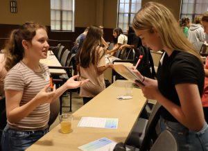 These girls participate in an ice-breaker game.