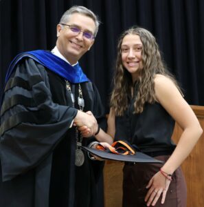 Dr. Scott Hummel, left, presents the President’s Award to Helena Walts.