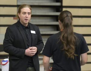Dr. Adam Denton, left, speaks with an incoming student at Pioneer Quest about the Honors Program.