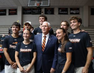 Mike Pence poses with student-athletes on the tennis teams, who served meals during the luncheon.