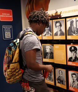A Tusculum University student looks at a profile of Harriet Tubman.