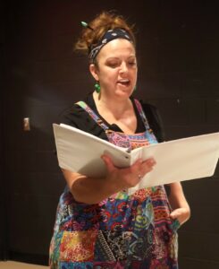 Erin Hensley Schultz, who plays Narrator, rehearses.