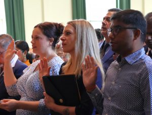 These new citizens take the oath.