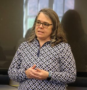 Dr. Heather Henson-Ramsey shares academic information with the audience.