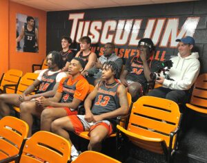 Kobe Funderburk, front center, was one of the students who shared his Tusculum experience. Part of the filming included a session with some of his fellow men’s basketball players and J.T. Burton, the head coach, back center.