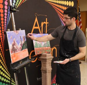 Benjamin Conley guides attendees in the painting.
