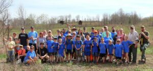 Tusculum University students, Cub Scout members and leaders and staff from David Crockett Birthplace State Park pose for a photo after completing their work.