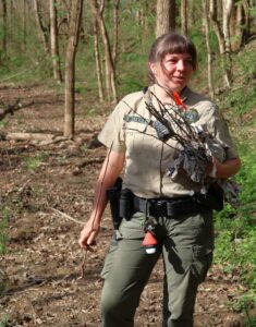 Chelsea Walters, a ranger at David Crockett Birthplace State Park, holds seedlings to be planted.