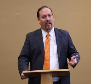 Dr. David Cook shares information with local ministers.