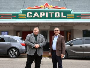 Edward Roberts, left and Dr. Scott Hummel stand in front of The Capitol Theatre in downtown Greeneville.