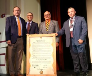 Left to right, Cal Doty, Greeneville’s mayor; Dr. Scott Hummel, Tusculum University’s president; Alan Corley, the City of Tusculum’s mayor; and Kevin Morrison, Greene County’s mayor, stand with the proclamation.