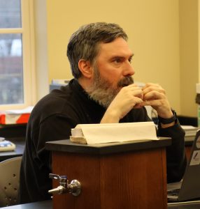 Dr. Chuck Pearson asks a question.