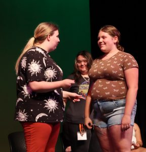Students present improvisational comedy.