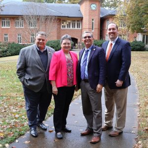 Lt. Col. Ginger Jacocks gathers with Tusculum leaders in front of the Thomas J. Garland Library. Left to right are Edward Roberts, Lt. Col. Ginger Jacocks, Dr. Scott Hummel and Dr. David Cook.