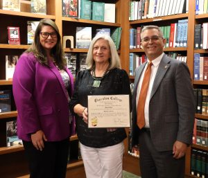 Left to right, Tiffany Greer, Mary Cansler Jones and Dr. Scott Hummel gather for a recent photo. Jones is holding Janie McCamey Larkin’s diploma from Tusculum.
