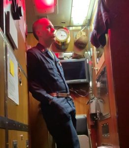 Ben Hankin stands in his stateroom in the USS Greeneville.