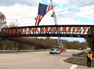 The sign for Tusculum University is unveiled.