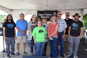Gail Winterbauer, fourth from the right, is joined by Tusculum alumni and members of the band Salty Moondogs.