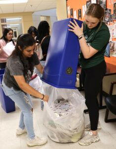 Students placed recyclable materials in bags.