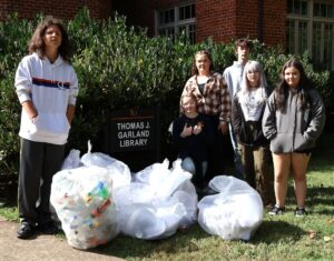 These students show what they collected from The Thomas J. Garland Library.
