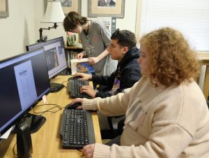 Left to right, Isabella Gall, J.P. Campione and Zoey Seay work on “The Tusculum Review.”