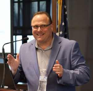 David Hite welcomes the audience and speaks about artificial intelligence.