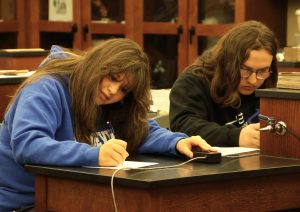 Madalynne Watts, left, and Rader Ketron work on an answer to one of the questions during the Tusculum Earlybird.