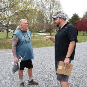 Community member Jim Foster, left, speaks with Jordan Baker, assistant professor of biology at Tusculum.